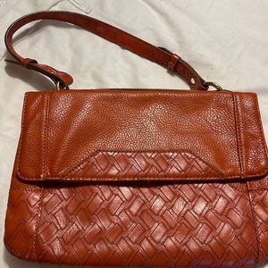 Clutch in rust leather